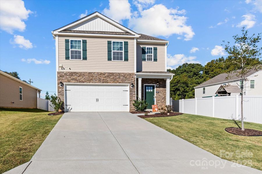 Front exterior of a new home in Wallace Springs, Statesville, NC, highlighting curb appeal (Image 1). Front exterior of a new home in Wallace Springs, Statesville, NC, highlighting curb appeal (Image 1).