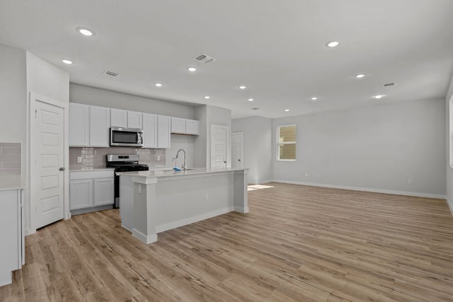 A kitchen with white cabinets. A kitchen with white cabinets.