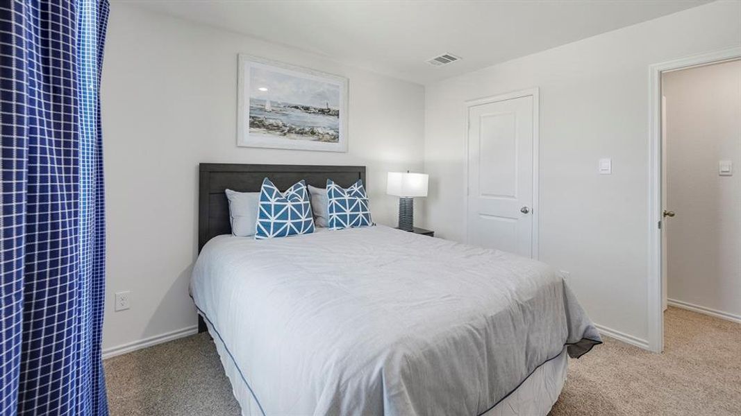 Bedroom with light colored carpet Bedroom with light colored carpet