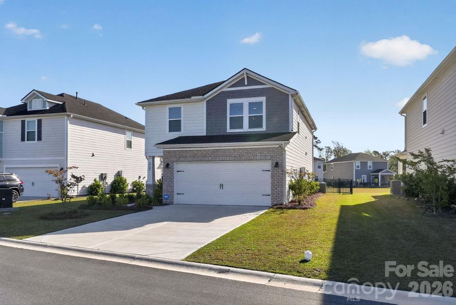 Front exterior of a new home in , Longs, SC, highlighting curb appeal (Image 24).