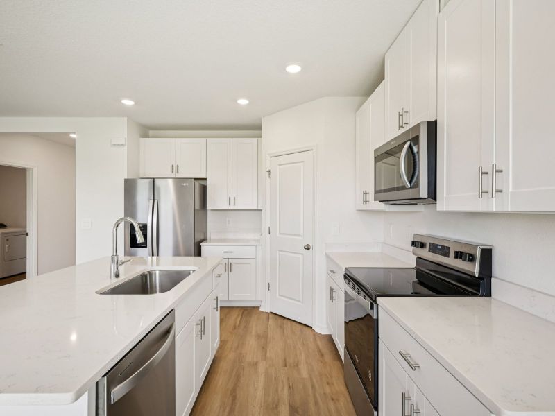 Furnished interior view inside a new home in The Grove at Stuart Crossing - Classic Series, Bartow (Image 7). Furnished interior view inside a new home in The Grove at Stuart Crossing - Classic Series, Bartow (Image 7).