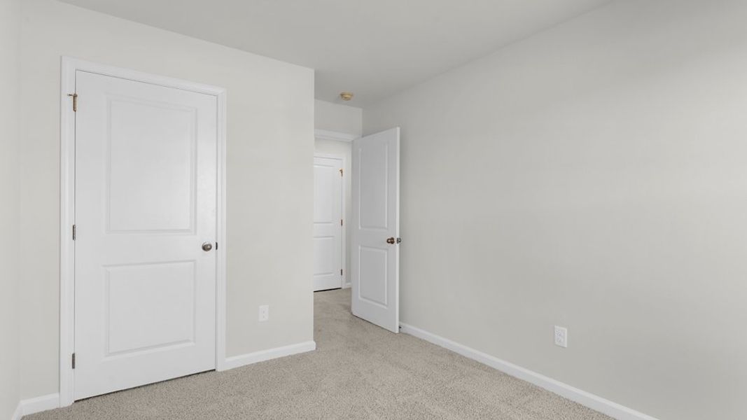 Spacious, unfurnished interior of a new home in The Townes at Belle Grove, Wendell (Image 29).