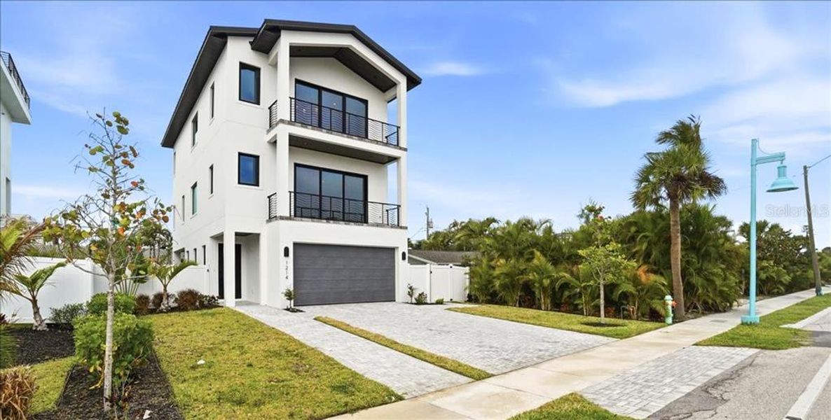 Front exterior of a new home in , Englewood, FL, highlighting curb appeal (Image 29).
