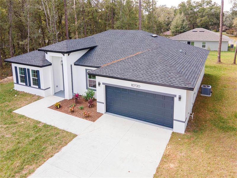Front exterior of a new home in , Citrus Springs, FL, highlighting curb appeal (Image 21).