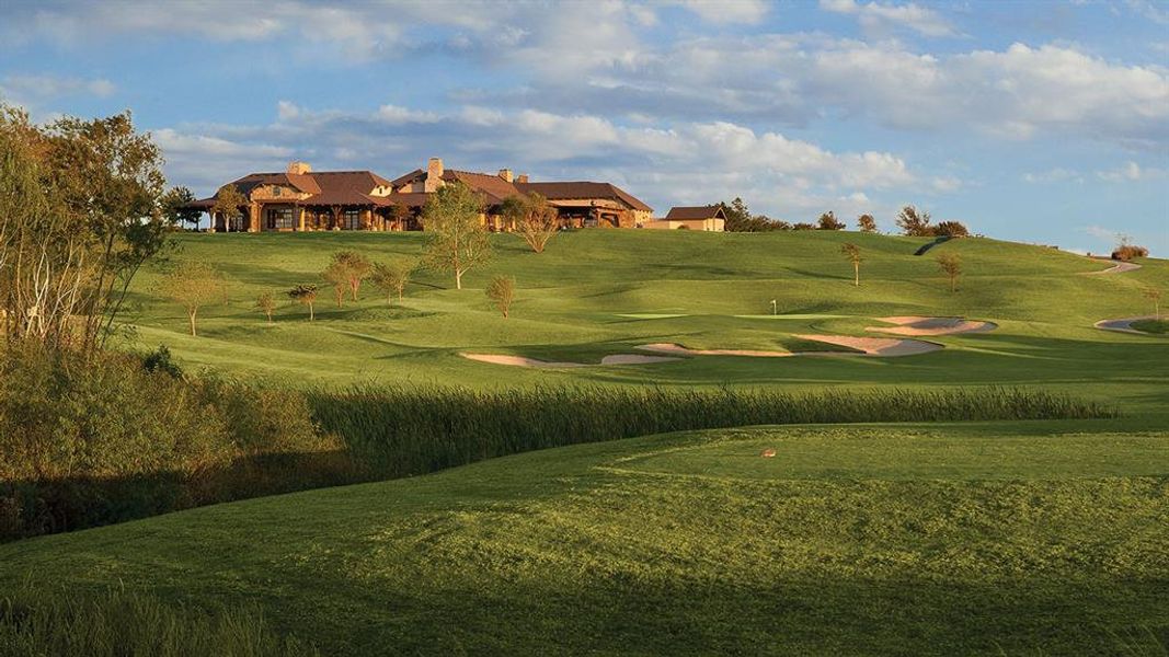 Expansive golf course setting featuring lush green fairways and sand traps