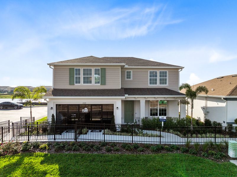 Front exterior of a new home in The Landings at Live Oak Lake, St. Cloud, FL, highlighting curb appeal (Image 1). Front exterior of a new home in The Landings at Live Oak Lake, St. Cloud, FL, highlighting curb appeal (Image 1).