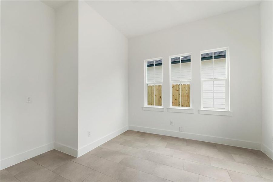 Imagine your perfect home office or an additional bedroom in this versatile space, bathed in abundant natural light.