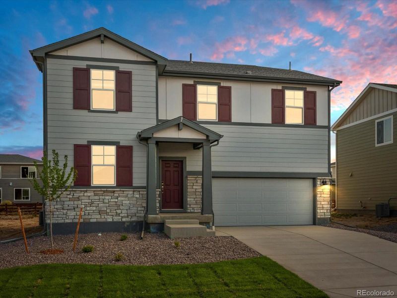 Front exterior of a new home in Revere at Johnstown, Johnstown, CO, highlighting curb appeal (Image 2).