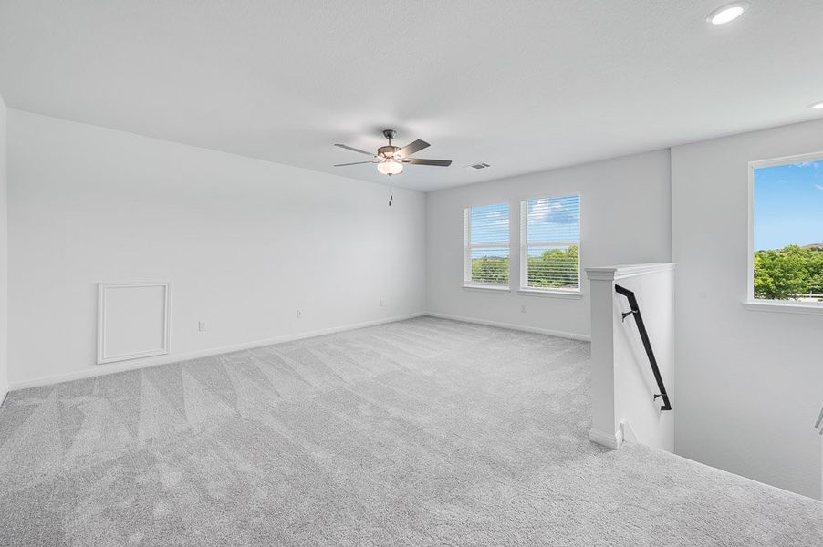 Representative unfurnished interior of a home built from the Sparrow by Taylor Morrison in Turner's Crossing 50s, Austin (Image 17).