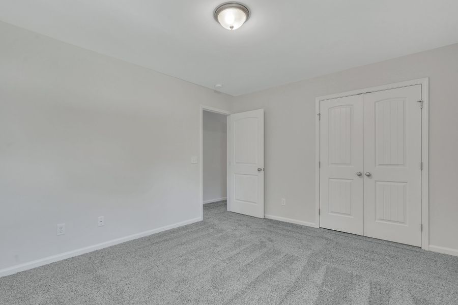 Representative unfurnished interior of a home built from the The Hatteras by Smith Family Homes in Ramsey Landing, Rincon (Image 29).