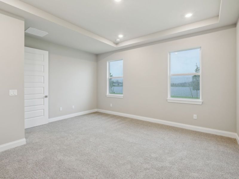 Primary Bedroom in the Coral floorplan at 6398 NW Sweetwood Dr