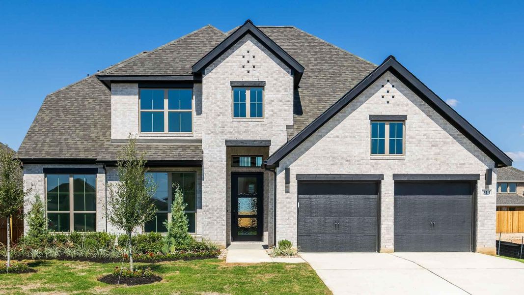 View of front of home with brick siding, concrete driveway, a garage, roof with shingles, and a front yard View of front of home with brick siding, concrete driveway, a garage, roof with shingles, and a front yard