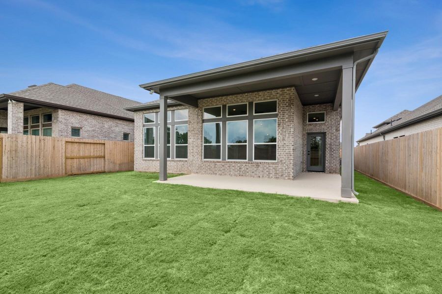 Front exterior of a new home in Harvest Green 45', Richmond, TX, highlighting curb appeal (Image 1).