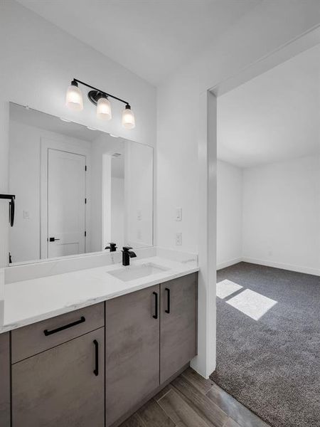 Bathroom with vanity and hardwood / wood-style floors