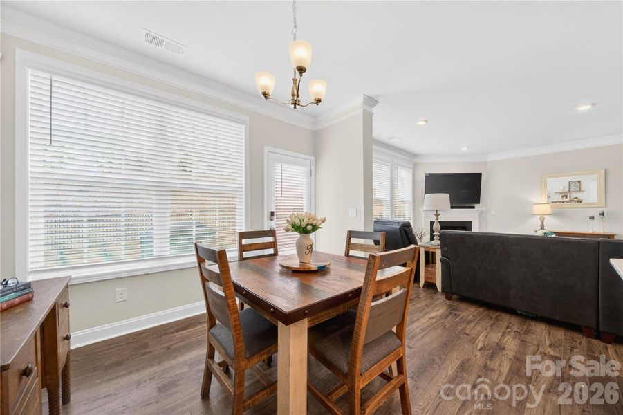 Room for an avg table and sideboard or a larger table.