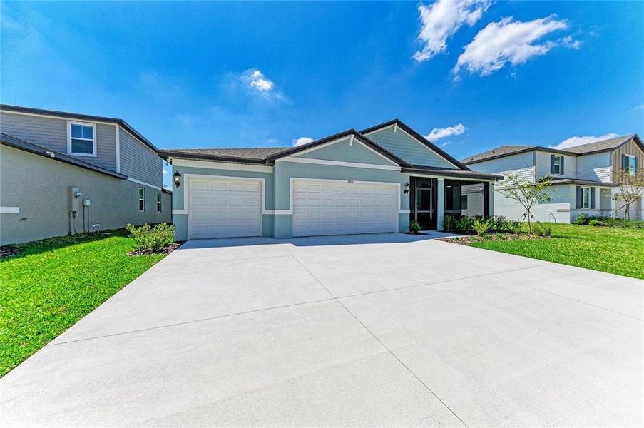 Front exterior of a new home in , Parrish, FL, highlighting curb appeal (Image 23). Front exterior of a new home in , Parrish, FL, highlighting curb appeal (Image 23).