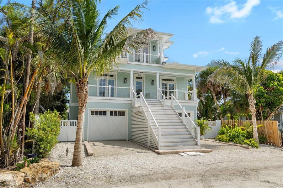 Front exterior of a new home in , Boca Grande, FL, highlighting curb appeal (Image 29). Front exterior of a new home in , Boca Grande, FL, highlighting curb appeal (Image 29).