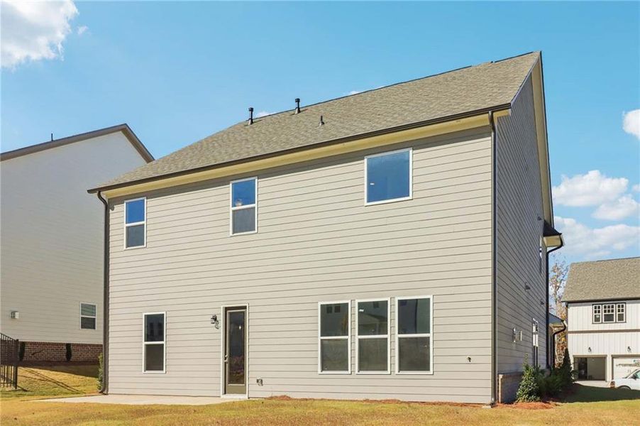 Exterior details and patio area of a home in East Harbor II at Chestatee, Dawsonville (Image 26).