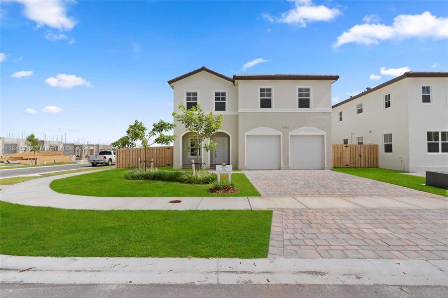 Front exterior of a new home in , Homestead, FL, highlighting curb appeal (Image 17).
