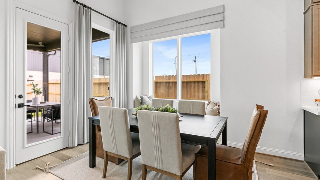 Representative furnished interior of a home built from the Magnolia by Brightland Homes in Sunterra, Katy (Image 9).