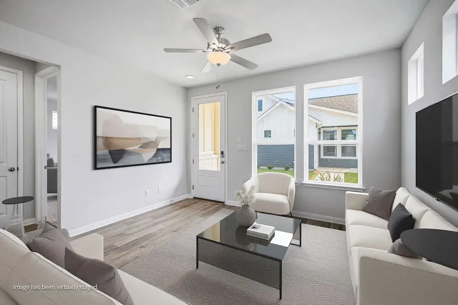 Clean lines and light-toned flooring define this welcoming space illuminated by numerous windows. Clean lines and light-toned flooring define this welcoming space illuminated by numerous windows.