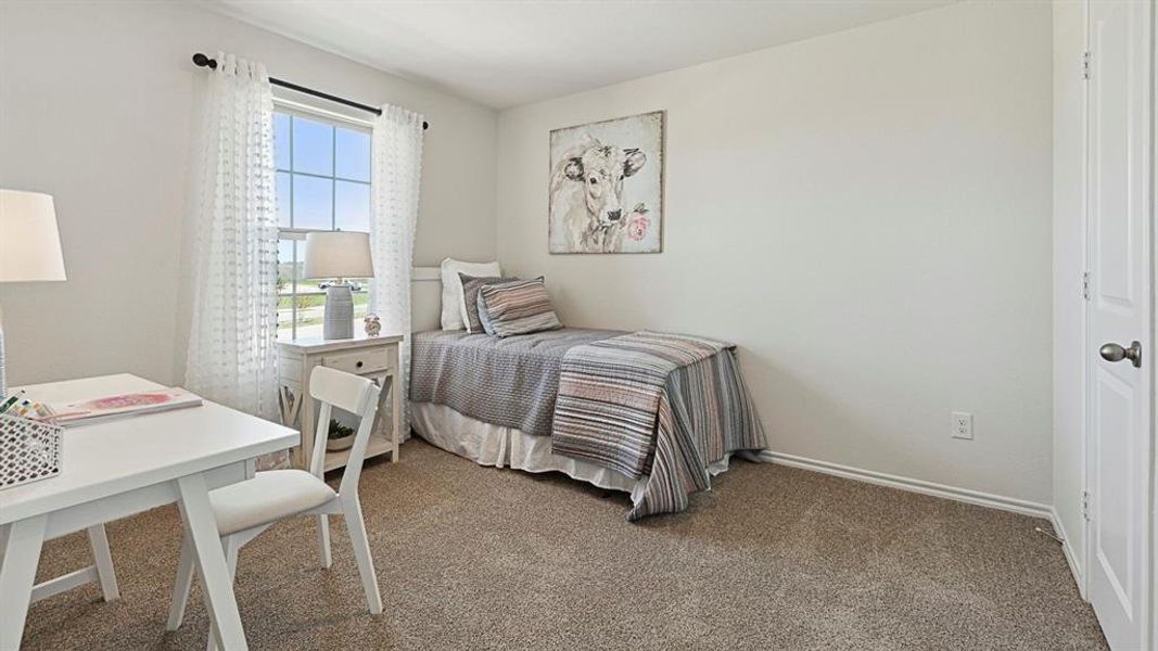The room features light-colored walls and carpeted flooring