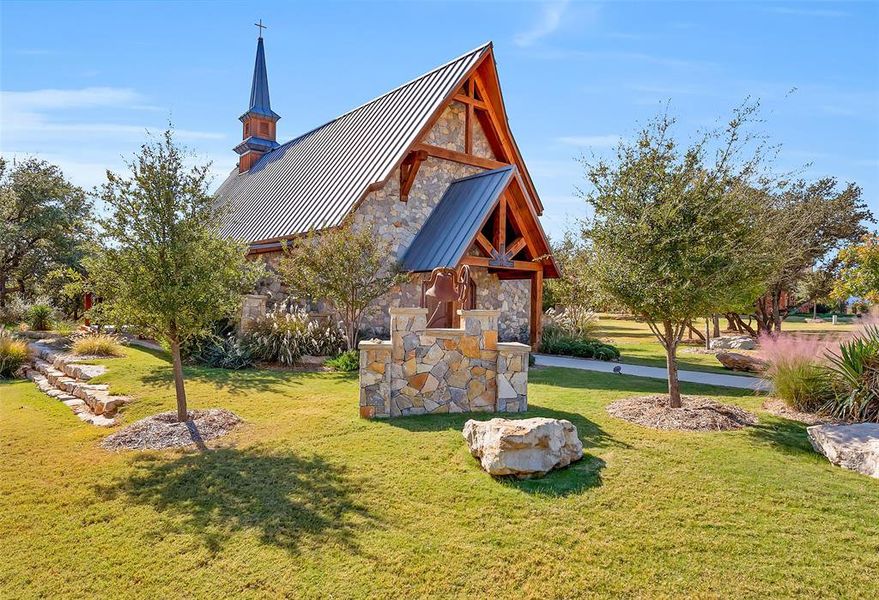 View of property's community with a lawn View of property's community with a lawn