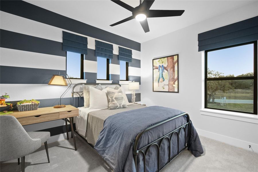 Bedroom with multiple windows, carpet floors, and a ceiling fan