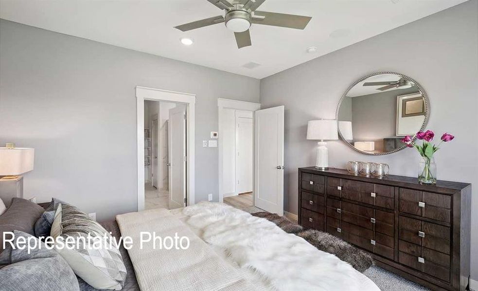 Bedroom with ceiling fan and wood-type flooring