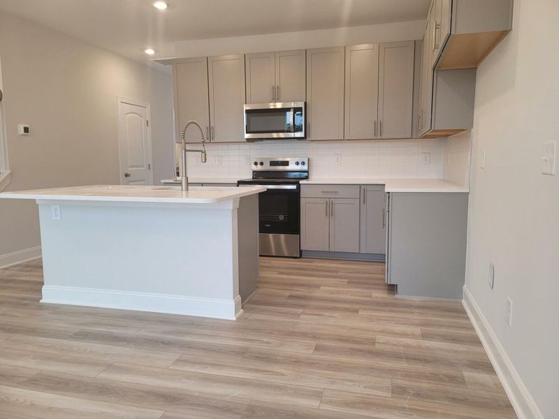 Furnished interior view inside a new home in 1158 Place Townhomes, Wilson (Image 4).