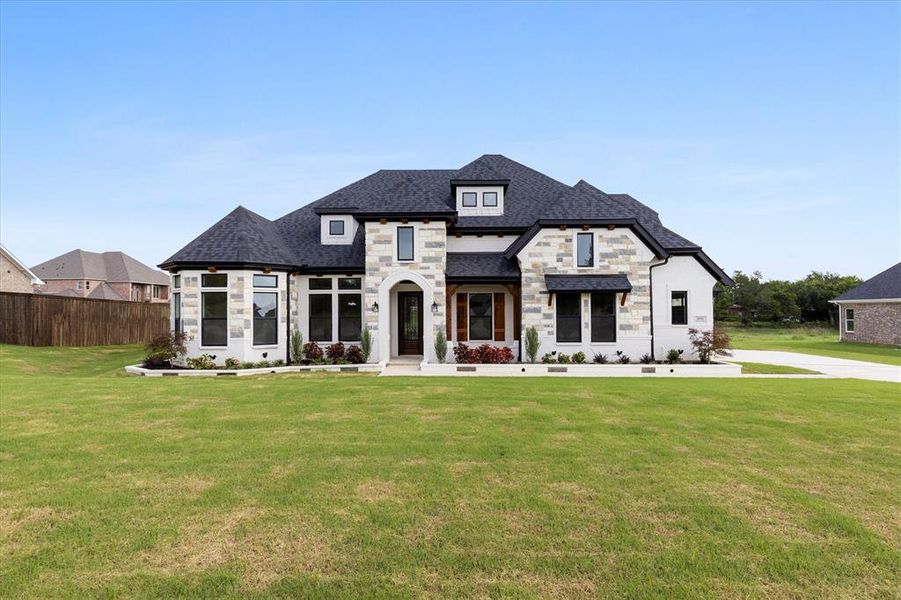 Front exterior of a new home in , Midlothian, TX, highlighting curb appeal (Image 2). Front exterior of a new home in , Midlothian, TX, highlighting curb appeal (Image 2).