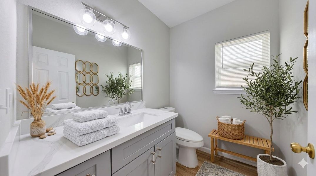This chic, conveniently located half-bath offers a private and stylish space for guests, enhancing the functionality of your first floor.