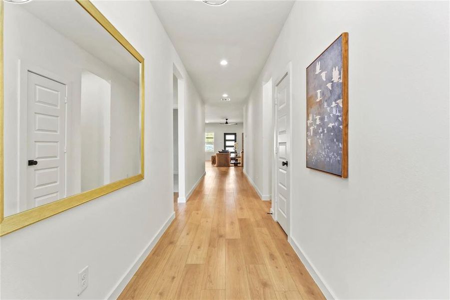 Hallway featuring light wood-style floors and recessed lighting Hallway featuring light wood-style floors and recessed lighting