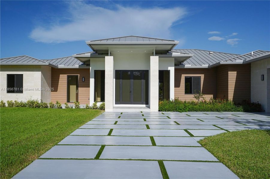 Front exterior of a new home in , Homestead, FL, highlighting curb appeal (Image 43).
