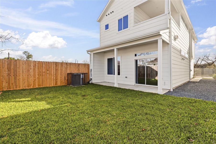 A covered patio that actually gets used, paired with a backyard that’s hard to find in new construction this close to the city.