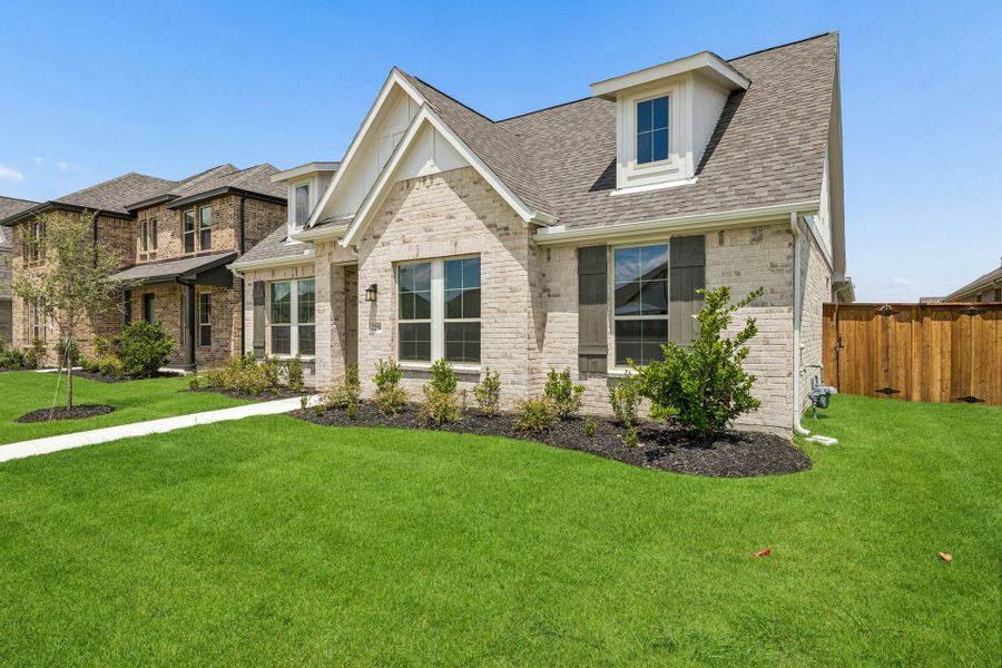 Front exterior of a new home in Dove Hollow, Waxahachie, TX, highlighting curb appeal (Image 21). Front exterior of a new home in Dove Hollow, Waxahachie, TX, highlighting curb appeal (Image 21).