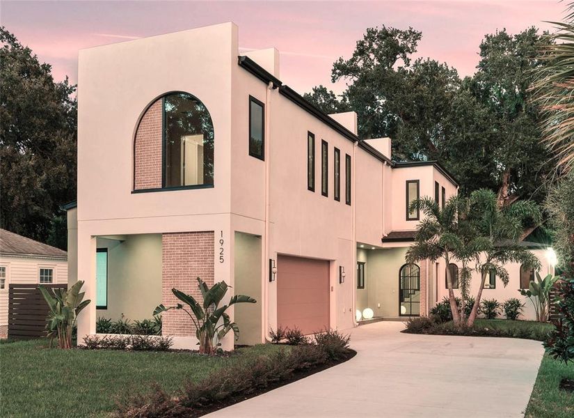 Front exterior of a new home in , Orlando, FL, highlighting curb appeal (Image 23).