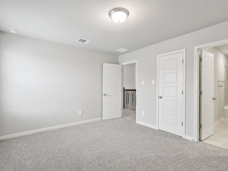 Guest bedroom in the San Jacinto floorplan at a Meritage Homes community.