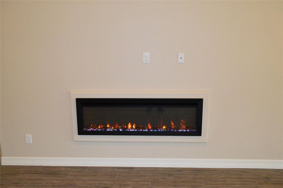 Detailed view of wood tiled floors and baseboards