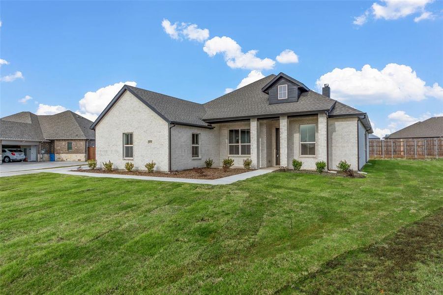 View of front of house with a front lawn