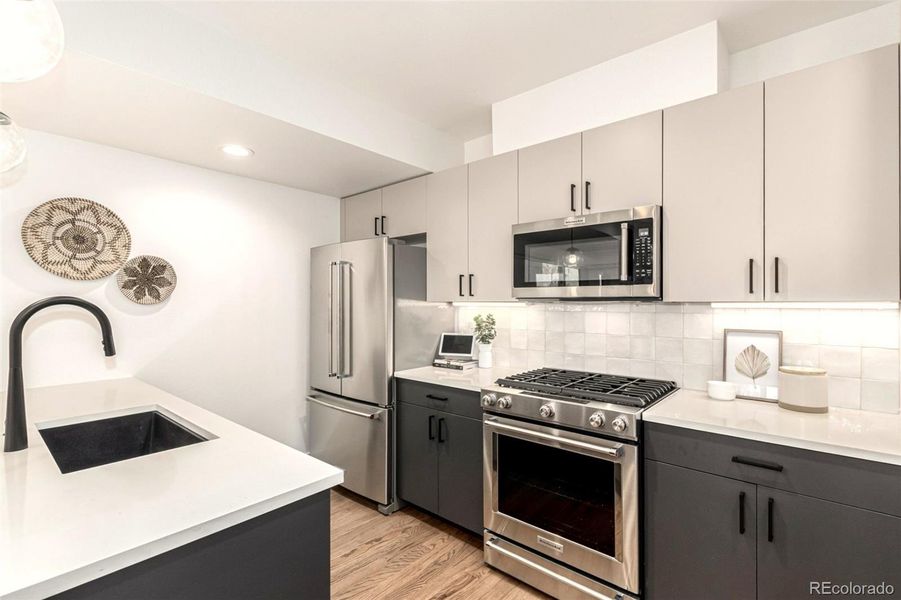 Eat in kitchen, stainless steel appliances, custom cabinets.Counter space, storage, large pantry.