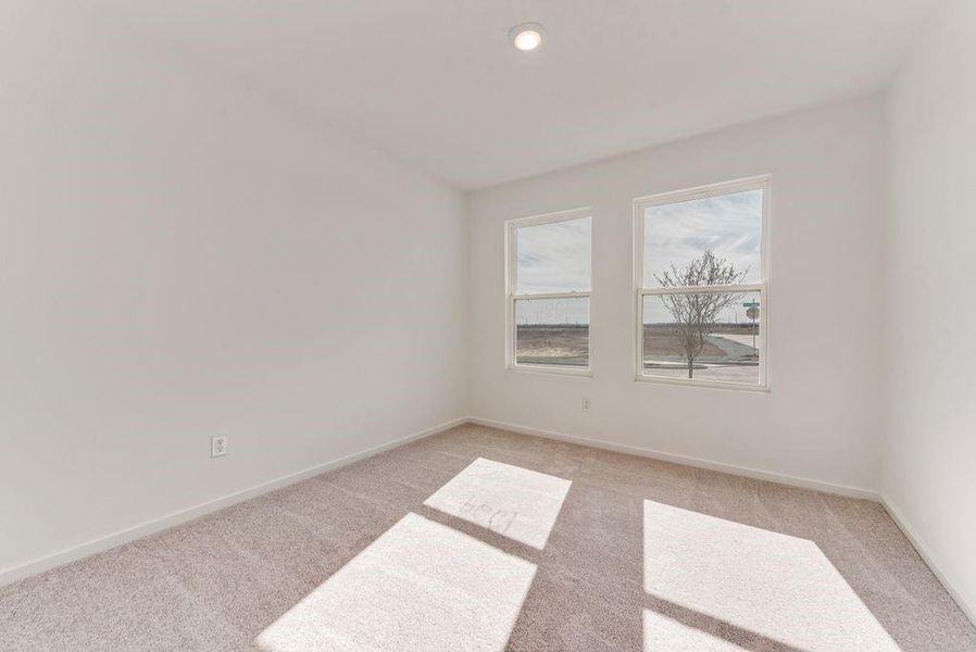 Empty room with light carpet, baseboards, and recessed lighting