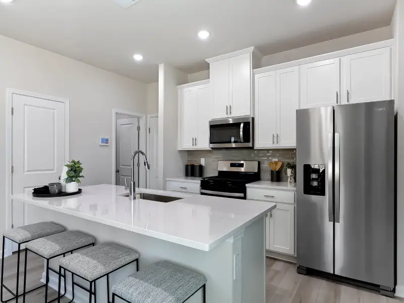 Furnished interior view inside a new home in Cadence Meadows Townes, Zebulon (Image 4). Furnished interior view inside a new home in Cadence Meadows Townes, Zebulon (Image 4).