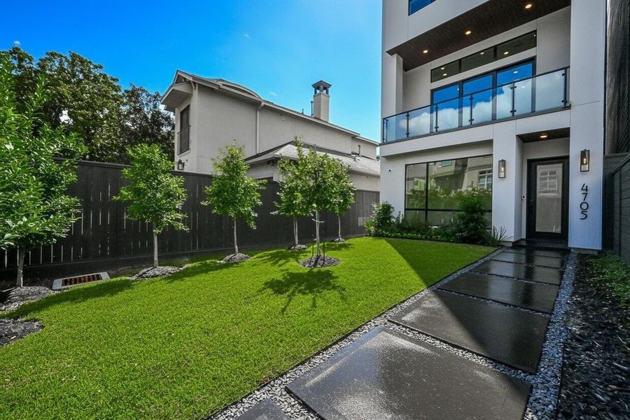 Large private fenced yard with room for a pool and GENERATOR! Lush Landscaping.