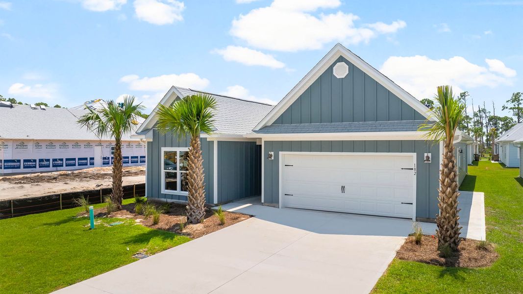 Front exterior of a new home in Windmark Beach, Port Saint Joe, FL, highlighting curb appeal (Image 2). Front exterior of a new home in Windmark Beach, Port Saint Joe, FL, highlighting curb appeal (Image 2).