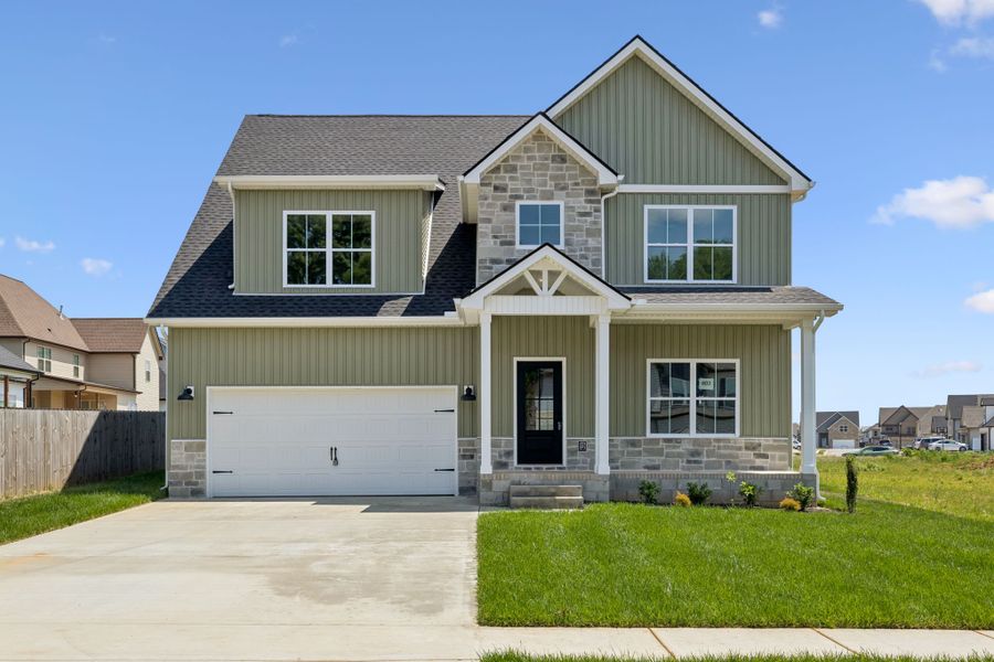 Front exterior of a new home in Summerfield, Clarksville, TN, highlighting curb appeal (Image 2). Front exterior of a new home in Summerfield, Clarksville, TN, highlighting curb appeal (Image 2).