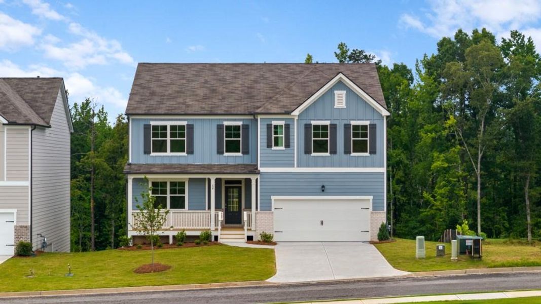 Front exterior of a new home in Sheffield Highlands, Dallas, GA, highlighting curb appeal (Image 1). Front exterior of a new home in Sheffield Highlands, Dallas, GA, highlighting curb appeal (Image 1).