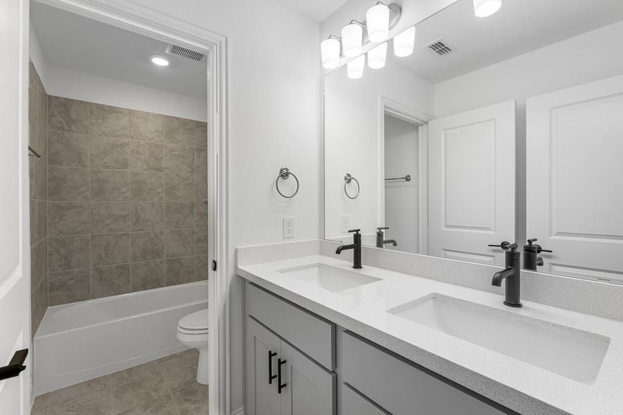 Representative furnished interior of a home built from the Camelia by Taylor Morrison in Stoneridge, Melissa (Image 16).