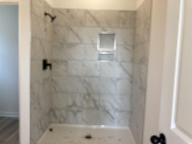 Bathroom featuring a shower stall Bathroom featuring a shower stall
