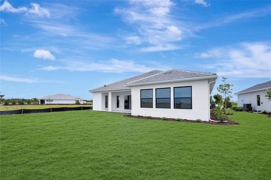 Exterior details and patio area of a home in Palmera Wellen Park - Classic Series, Venice (Image 11).